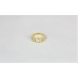 A diamond signet ring set with a single round diamond in 18ct white and yellow gold