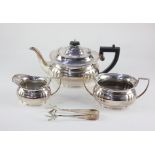 An Ashberry Sheffield silver plated three piece tea set, comprising tea pot, milk jug and sugar