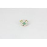 An opal and emerald cluster ring in 9ct yellow gold