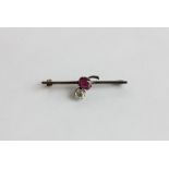 An old cut diamond and ruby bar brooch