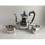 An Elizabeth II silver three piece coffee set, maker Harrison Fisher & Co, Sheffield 1973, of