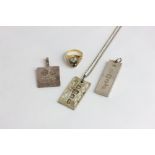 A 14ct gold paste set ring, three silver ingot pendants