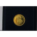 A gold commemorative St. Hubert coin stamped 900 3.5g