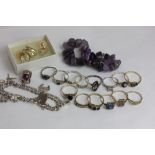 Fourteen various gem set rings, an amethyst quartz bracelet, earrings and a silver bracelet