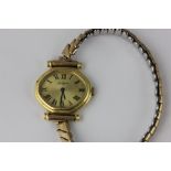 A lady's 18ct gold Paul Laurin watch on gilt bracelet