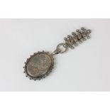 A late Victorian silver locket engraved in the aesthetic taste