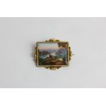 A 19th century continental gold and enamel brooch painted with a river view