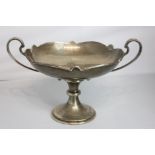 An Edwardian silver two-handle pedestal bowl with scalloped edge on knop stem and flared circular