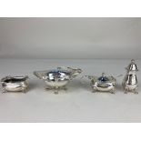 A George VI silver three piece matched cruet set, maker Walker & Hall, Chester 1938, 1939, with