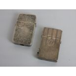 Two sterling silver cased cigarette lighters one with stripe engraved decoration and initials, the