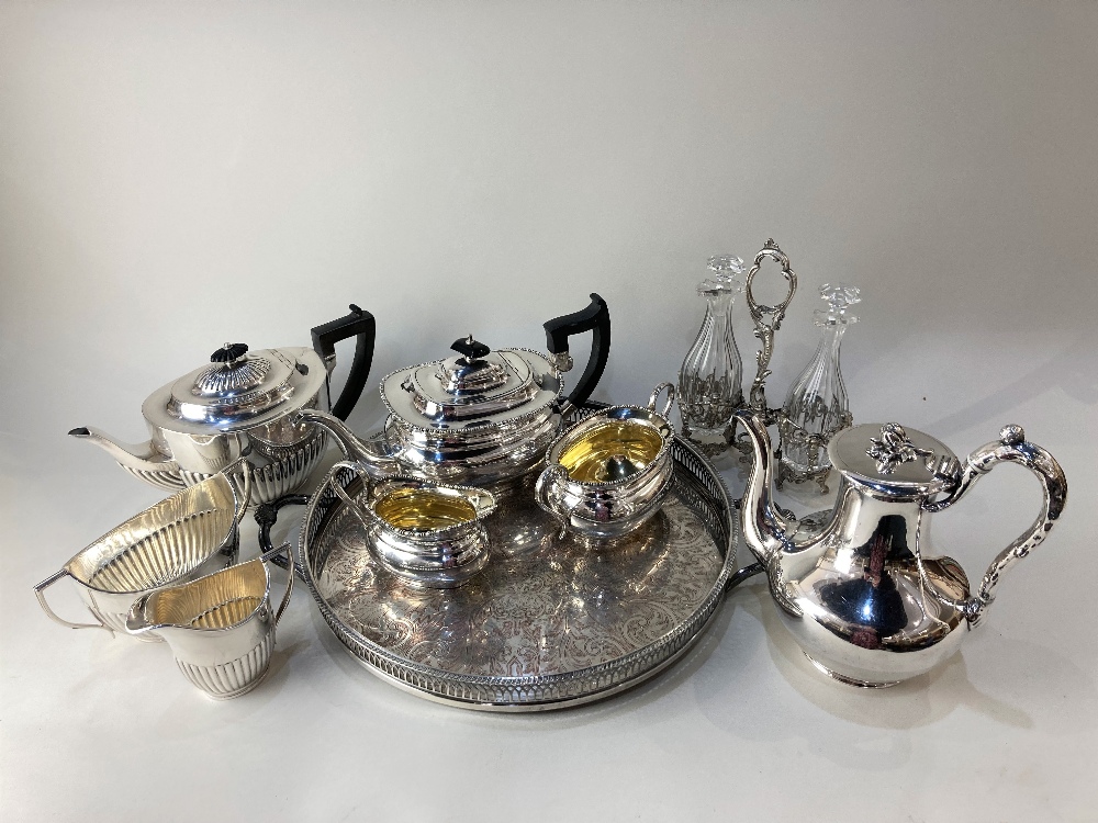 An Elkington & Co silver plated teapot, with naturalistic handle and finial, together with a two