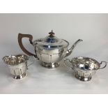 A George V silver three piece tea set, maker Boodle & Dunthorne, Birmingham 1936, of circular