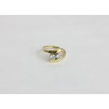 A diamond two stone crossover ring in 18ct yellow and white gold 5.6g gross