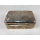 An Edward VII silver cigarette box, maker Henry Matthews, Birmingham 1909, monogrammed, (a/f) 14cm