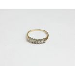 A 9ct gold seven stone diamond ring