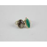 A jade ring in 14ct gold; a smoky quartz ring in 9ct gold