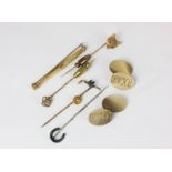 A pair of 9ct gold oval engine turned cuff links 15g; a gold fox mask stick pin; various stick and