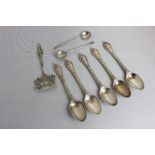 A set of five Victorian silver teaspoons with bead and cartouche terminal handles, maker Chawner and