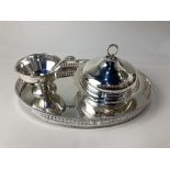 A silver plated oval galleried tea tray, a silver plated muffin dish and cover, and a silver