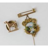 A 15ct gold and enamel pendant painted with a river scene 6.7g gross, and a 9ct gold button in the