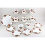 A Royal Albert porcelain 'Old Country Roses' part tea service, comprising platter, milk jug, sugar