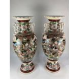 A pair of large Japanese Satsuma baluster vases, decorated with scenes of warriors, (a/f) 62cm high