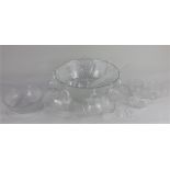 A textured glass punch bowl and eight cups with additional plastic ladle and hanging hooks, 31cm