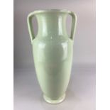 A Fulham Pottery vase, with two handles and pale yellow green glaze, the base with Fulham Pottery