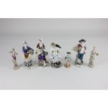 A collection of seven Continental porcelain figures, to include a figure of a girl holding a