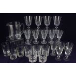 A plain glass water jug, four glass rummers and five drinking glasses, with part fluted bowls,