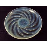 A Lalique 'Poissons' opalescent glass dish, decorated with spiralled fish around central air