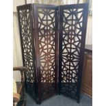 A modern three section room screen, each panel with pierced geometric design, (a/f) 155cm high by