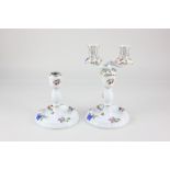 A pair of Herend porcelain two branch candlesticks (one missing the top section), decorated with