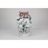 A Japanese polychrome porcelain vase, of baluster form, decorated with a warrior amongst a