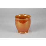 A small Moorcroft Burslem pottery orange lustre vase, 8cm high