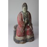 A Chinese carved wooden figure of a Court Attendant, with polychrome decoration, 38cm high