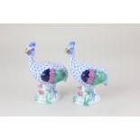 A pair of Herend porcelain models of guinea fowl, with blue fishnet bodies and gilt beaks, 15.5cm