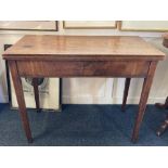 A 19th century mahogany rectangular tea table with fold over top on four square tapered legs (some