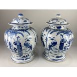 A near pair of Chinese blue and white porcelain ginger jars and covers, of baluster form,