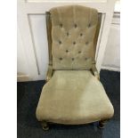 A Victorian button upholstered chair with green and gilt painted frame