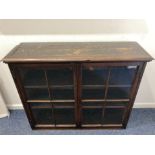 A 19th century mahogany bookcase top section, with two glazed panel doors enclosing two shelves,