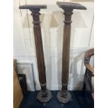 A pair of Victorian mahogany torcheres with square tops (a/f) on carved faceted supports and