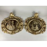 A pair of oval gilt wood picture frames with scrolling pierced foliate decoration, each frame to