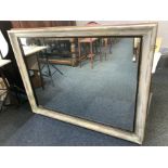 A large modern painted pine rectangular wall mirror, 137cm by 105cm