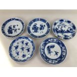 A collection of five Chinese blue and white porcelain plates, decorated with various figural scenes,