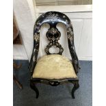 A Victorian black papier mache chair with pierced back splat, drop in upholstered seat on cabriole
