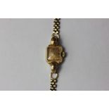 A lady's 9ct Invicta bracelet watch 10.1g weighable