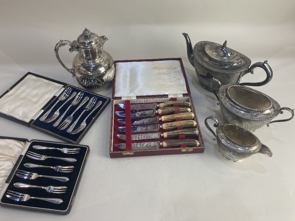 A Walker & Hall silver plated three piece tea set, and a Walker & Hall silver plated hot water