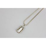 A baroque pearl and diamond pendant in 14ct yellow gold on an 18ct gold neck chain
