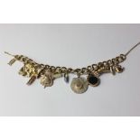 A 9ct gold charm bracelet 54.8g gross